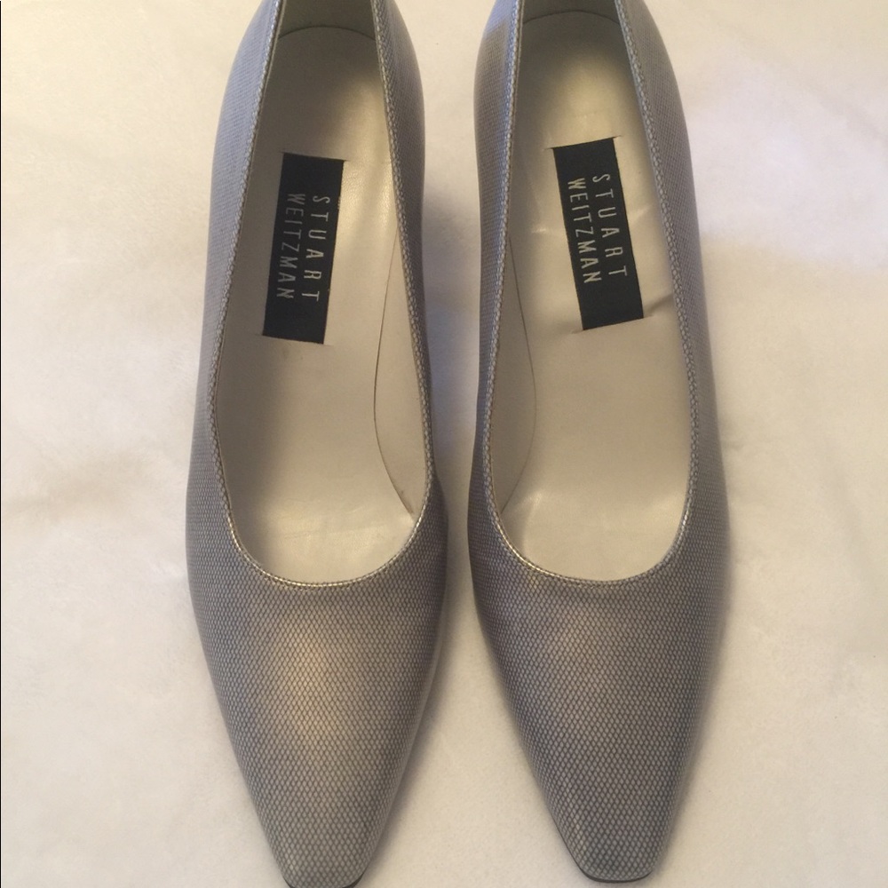 Silver Stuart Weitzman pumps with 3 inch heel.